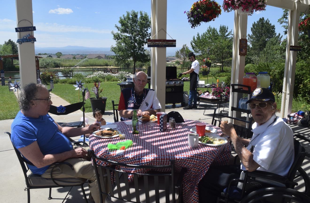 Outdoor community barbecue with residents and guests