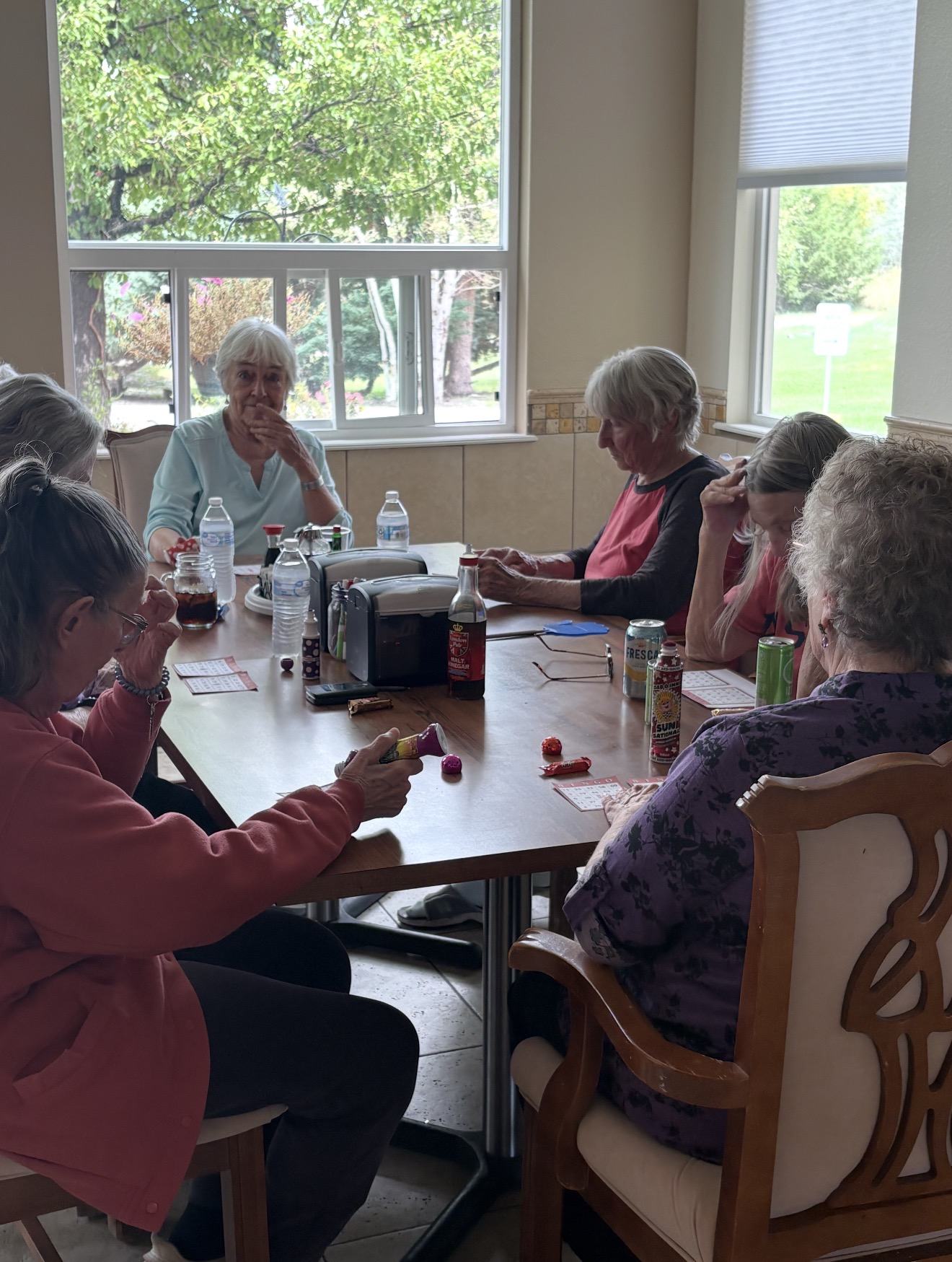 Residents playing bingo together at Spring Creek Chalet